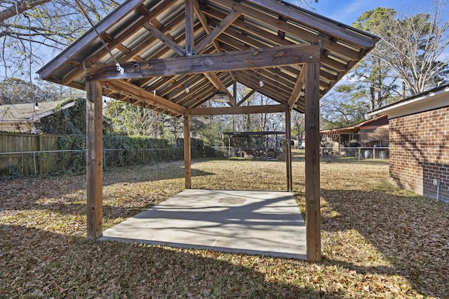 view of patio with a fenced backyard and a gazebo