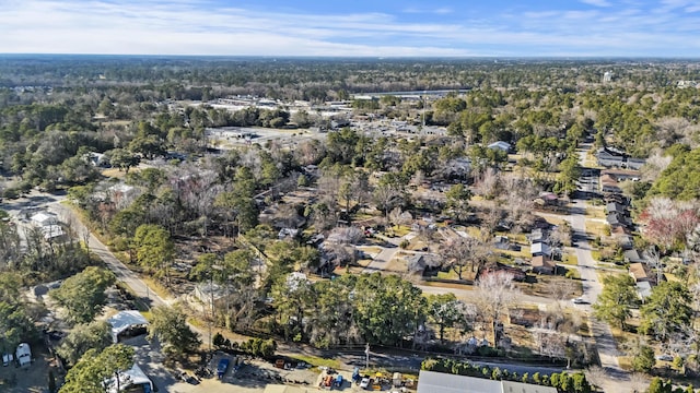 drone / aerial view featuring a forest view