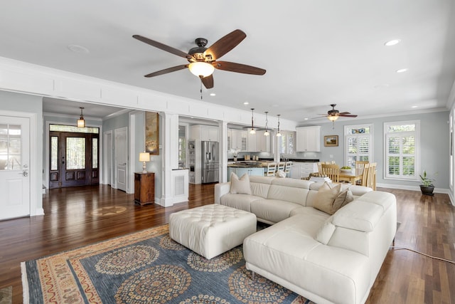 living room with crown molding, ceiling fan, and recessed lighting