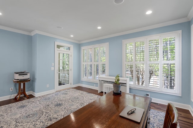 dining area featuring dark wood-type flooring, baseboards, and crown molding