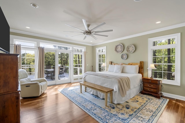bedroom with recessed lighting, multiple windows, access to exterior, and crown molding