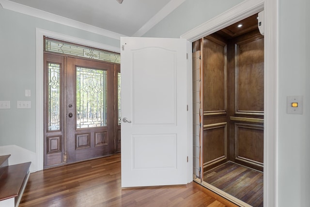 entrance foyer featuring dark wood-style floors and elevator