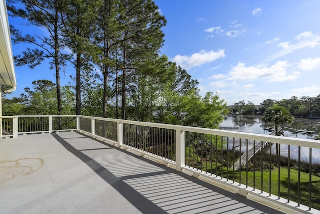wooden deck featuring a water view