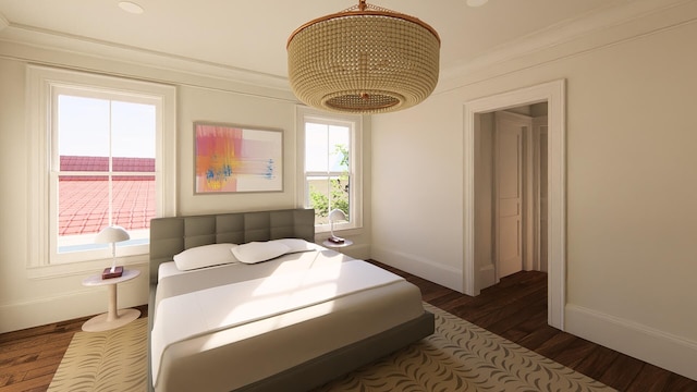 bedroom featuring dark wood finished floors and baseboards