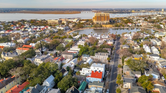 drone / aerial view featuring a water view and a residential view