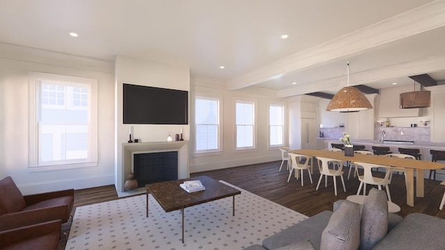 living room with beam ceiling, a fireplace, recessed lighting, wood finished floors, and baseboards