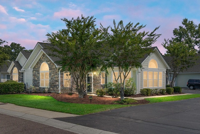 8800 Dorchester Rd Unit 2004, North Charleston, SC 29420 - view of property hidden behind natural elements with stone siding and a front yard