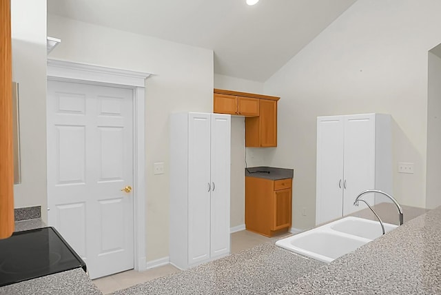 8800 Dorchester Rd Unit 2004, North Charleston, SC 29420 - kitchen featuring lofted ceiling, brown cabinetry, electric range oven, and recessed lighting