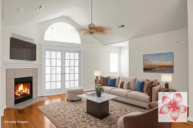 8800 Dorchester Rd Unit 2004, North Charleston, SC 29420 - living area featuring wood finished floors, ceiling fan, vaulted ceiling, and a fireplace