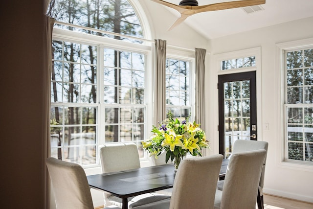 sunroom / solarium featuring lofted ceiling and ceiling fan