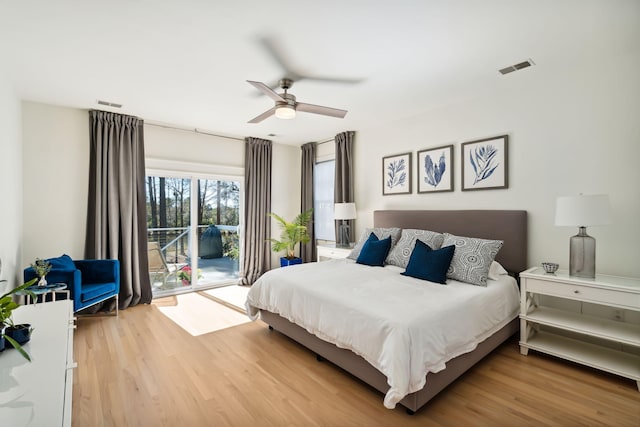 bedroom featuring hardwood / wood-style flooring, access to outside, and ceiling fan