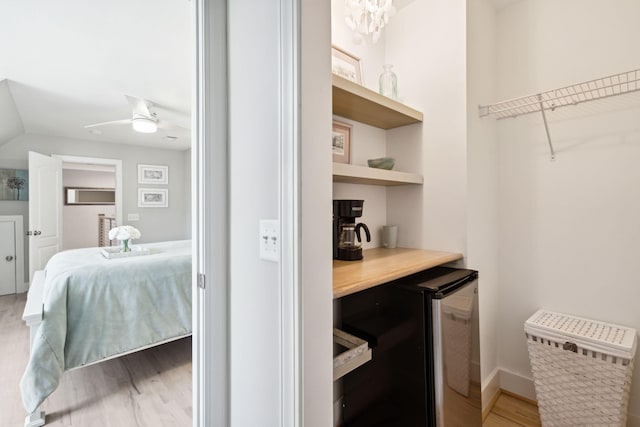 interior space featuring hardwood / wood-style flooring and stainless steel fridge