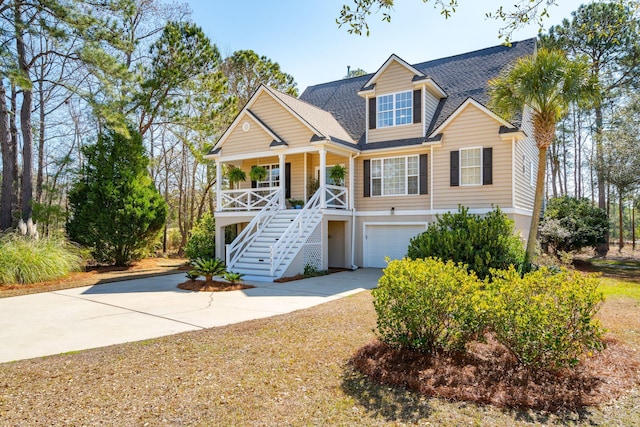 view of front of house with a garage and a porch