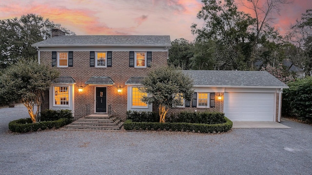 colonial home featuring a garage