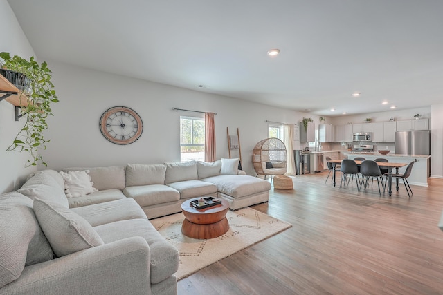 living room with light hardwood / wood-style floors