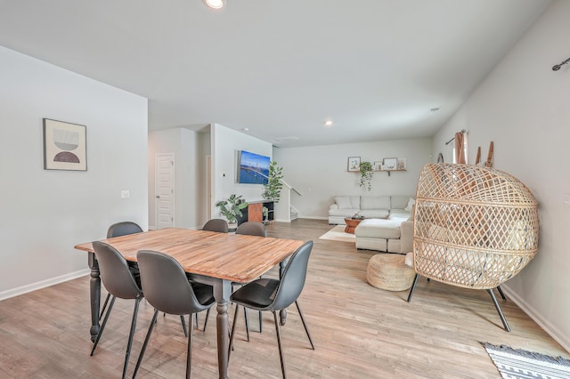 dining area featuring light wood-type flooring