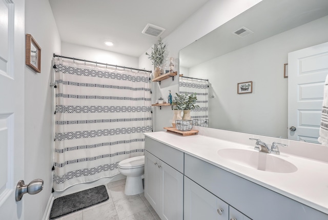 bathroom featuring vanity, a shower with curtain, tile patterned floors, and toilet