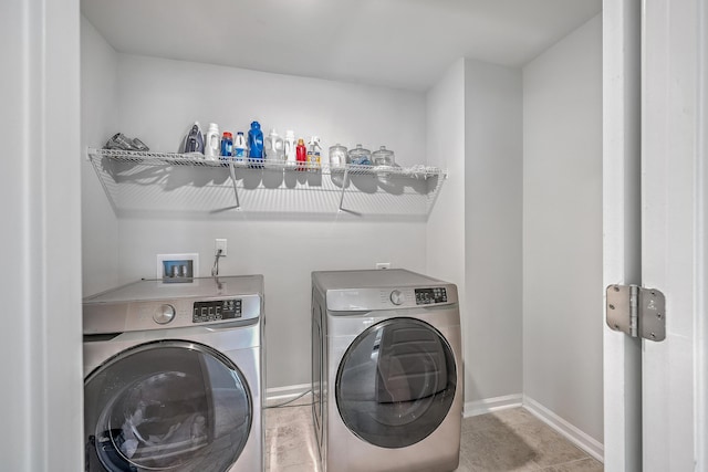 washroom featuring washer and clothes dryer