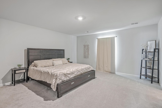 bedroom with light carpet