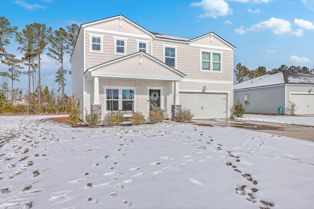 view of front facade with a garage and covered porch