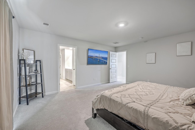 carpeted bedroom featuring connected bathroom