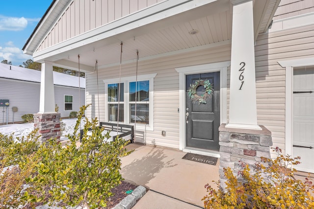 doorway to property with a porch