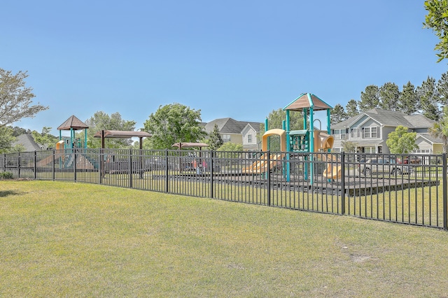 view of jungle gym featuring a lawn