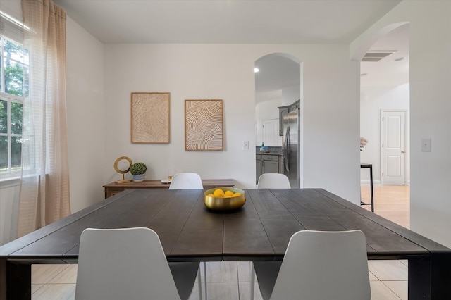 8328 Berringer Blf, North Charleston, SC 29418 - dining room featuring arched walkways and light tile patterned flooring