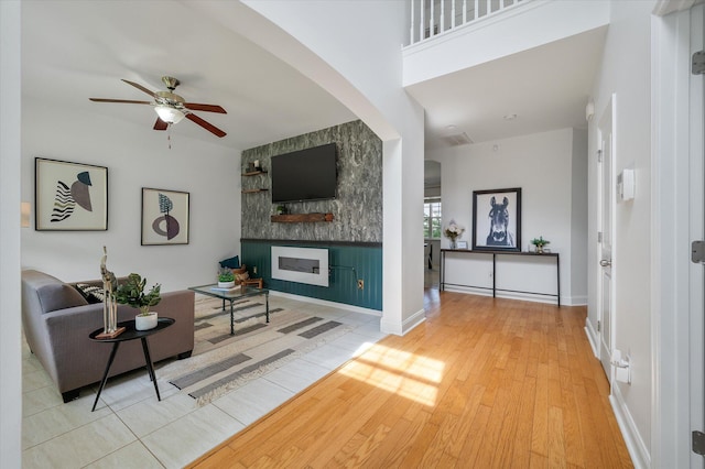 8328 Berringer Blf, North Charleston, SC 29418 - living area with a large fireplace, ceiling fan, and wood finished floors