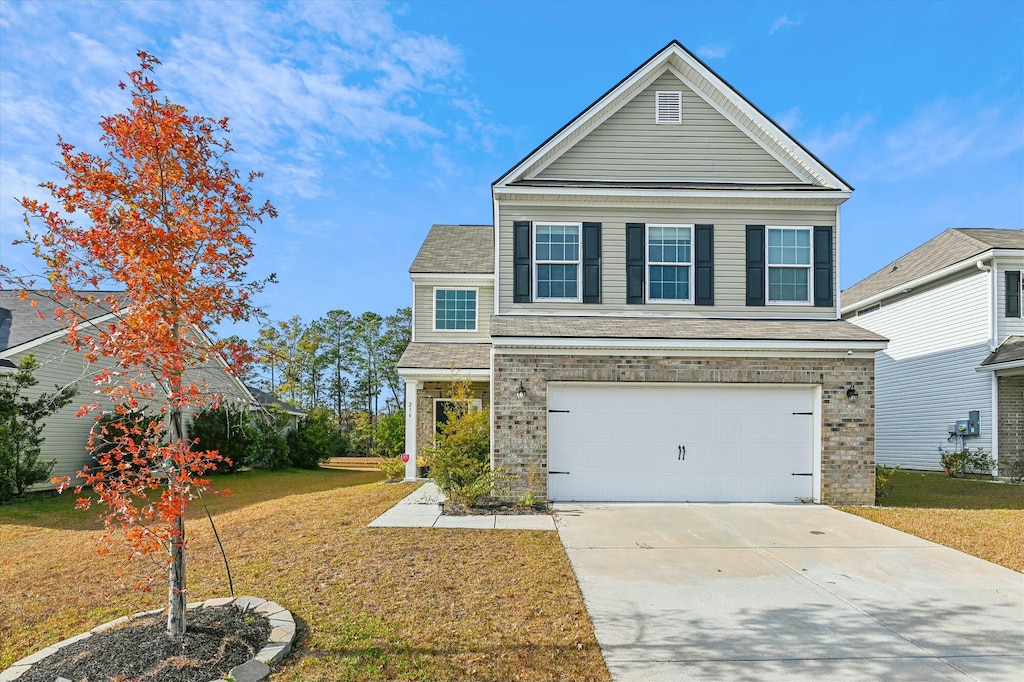 front of property featuring a garage and a front yard