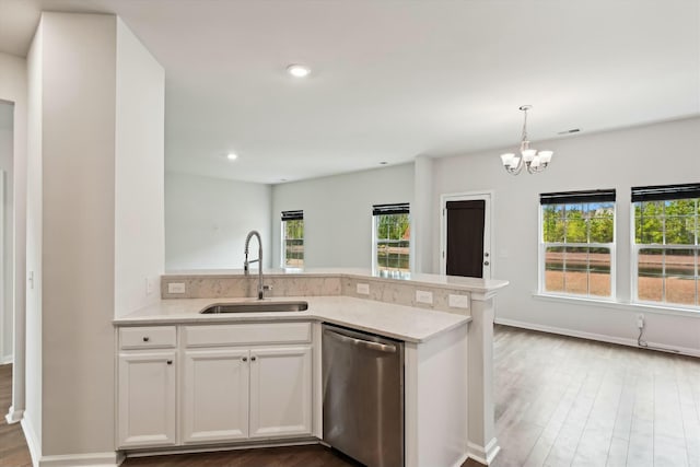 kitchen featuring white cabinets, dishwasher, plenty of natural light, and sink