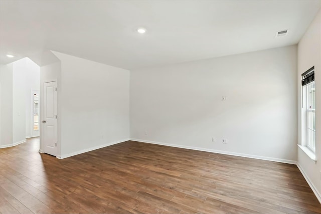 spare room featuring hardwood / wood-style floors