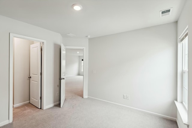 unfurnished bedroom with light carpet