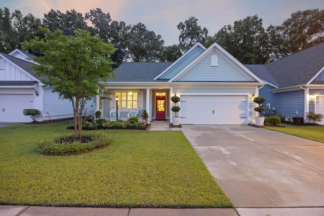 148 Longdale Dr, Summerville, SC 29483 - ranch-style home featuring an attached garage, driveway, a front yard, and covered porch
