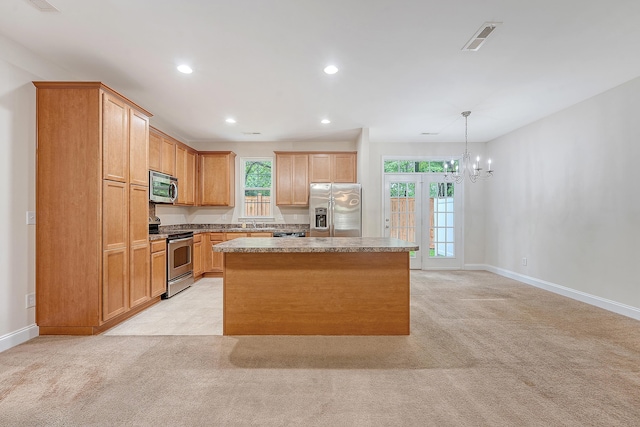 9646 Scarborough Ct, Summerville, SC 29485 - kitchen featuring stainless steel appliances, a chandelier, a center island, recessed lighting, and light colored carpet