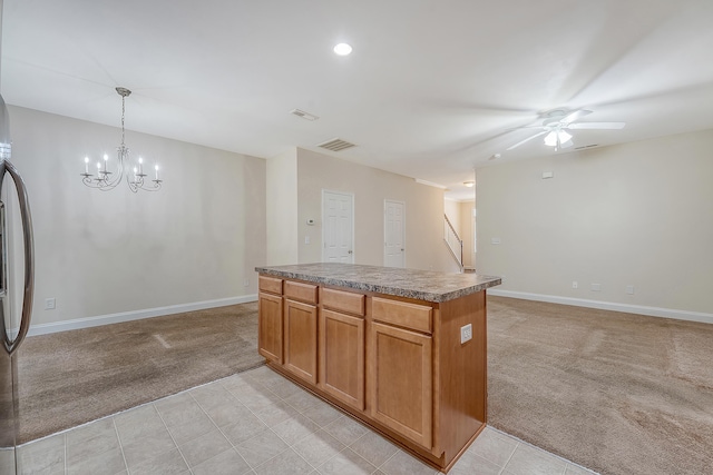 9646 Scarborough Ct, Summerville, SC 29485 - kitchen featuring light carpet, baseboards, a chandelier, ceiling fan, and a kitchen island