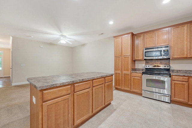 9646 Scarborough Ct, Summerville, SC 29485 - kitchen featuring stainless steel appliances, ceiling fan, recessed lighting, a center island, and light tile patterned floors