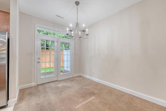 9646 Scarborough Ct, Summerville, SC 29485 - unfurnished dining area with a chandelier, light colored carpet, and baseboards