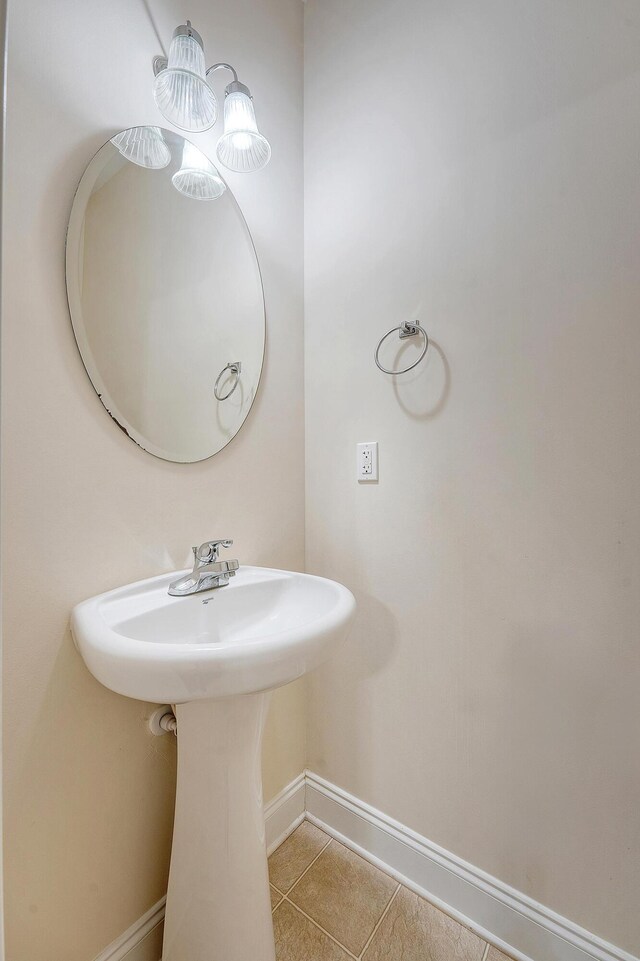 9646 Scarborough Ct, Summerville, SC 29485 - bathroom featuring baseboards, tile patterned flooring, and a sink
