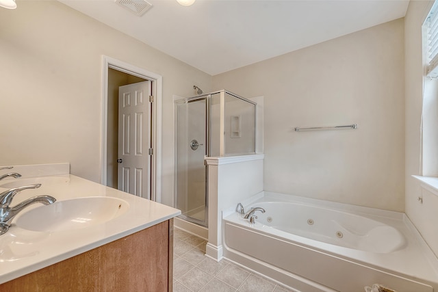 9646 Scarborough Ct, Summerville, SC 29485 - bathroom featuring a stall shower, a jetted tub, tile patterned floors, and double vanity
