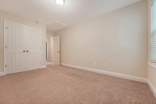 9646 Scarborough Ct, Summerville, SC 29485 - unfurnished bedroom with light colored carpet, baseboards, a closet, and attic access