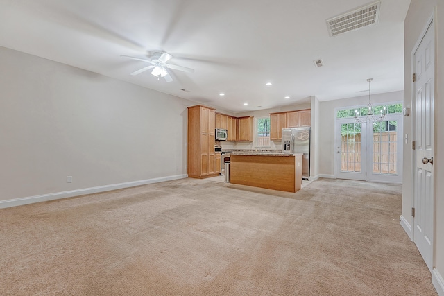 9646 Scarborough Ct, Summerville, SC 29485 - unfurnished living room featuring ceiling fan, baseboards, light carpet, recessed lighting, and a chandelier
