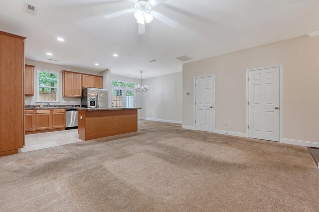 9646 Scarborough Ct, Summerville, SC 29485 - kitchen featuring appliances with stainless steel finishes, a center island, a chandelier, ceiling fan, and healthy amount of natural light