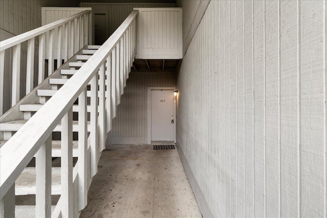 stairs featuring concrete floors