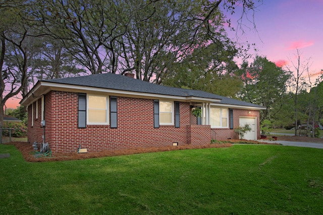 ranch-style house featuring brick siding, crawl space, a garage, driveway, and a front lawn