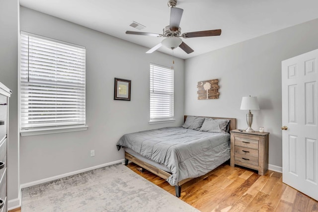 bedroom featuring light hardwood / wood-style floors and ceiling fan