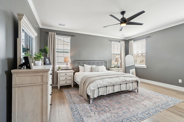 643 Blueway Ave, Summerville, SC 29486 - bedroom with visible vents, baseboards, ornamental molding, wood finished floors, and a ceiling fan