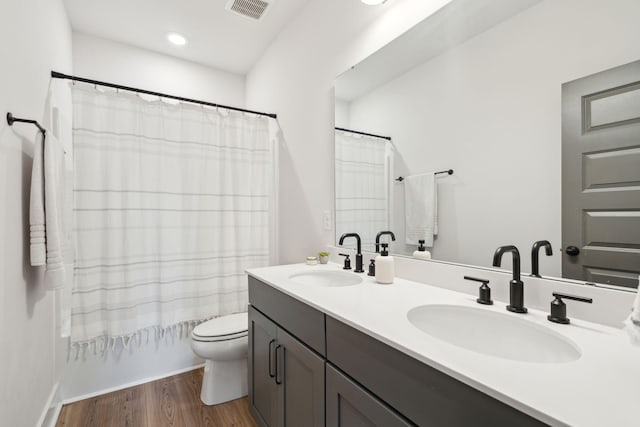 643 Blueway Ave, Summerville, SC 29486 - bathroom with a sink, visible vents, toilet, and wood finished floors