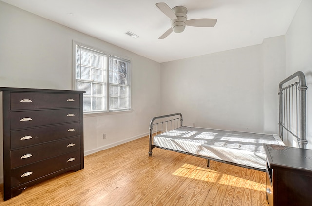 bedroom with ceiling fan and light hardwood / wood-style flooring