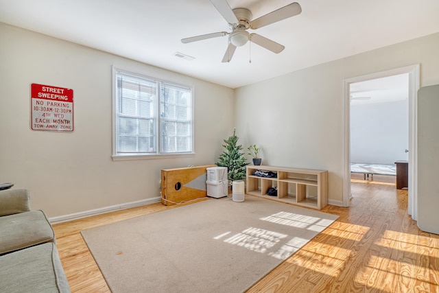 sitting room featuring light hardwood / wood-style flooring and ceiling fan